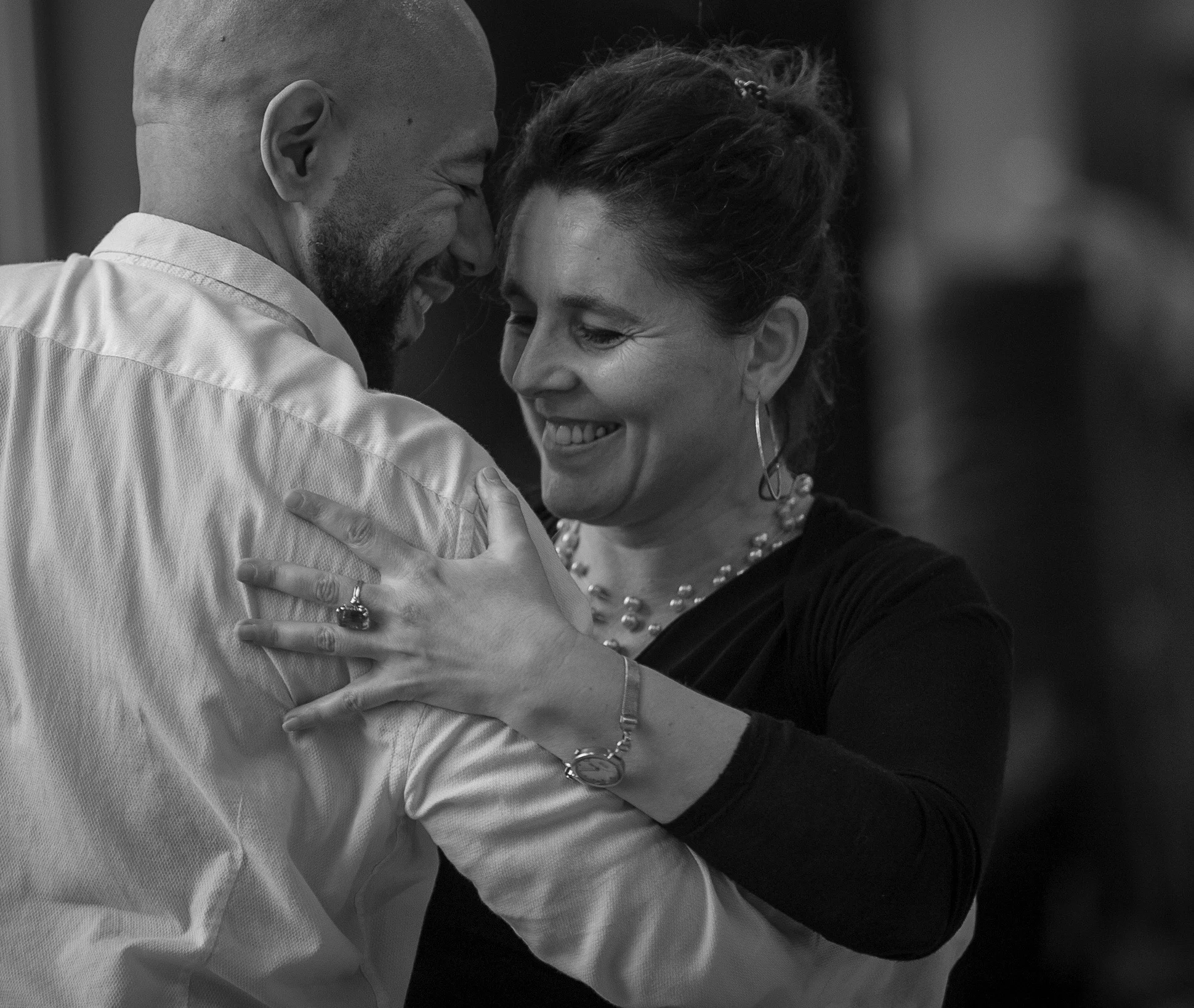 tango couple enjoying themselves in class