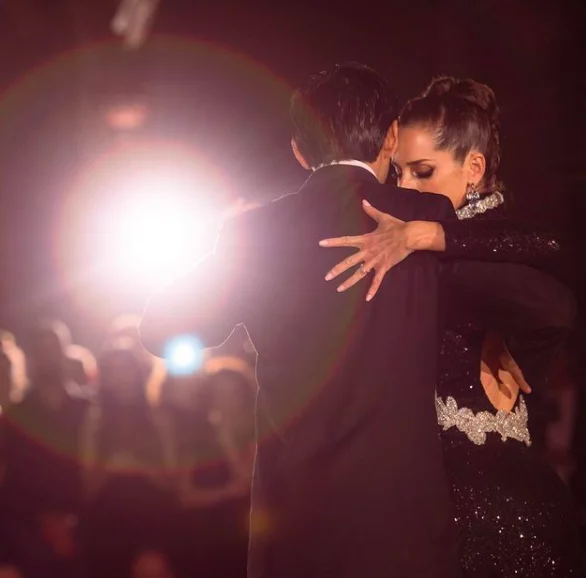 tango dancers under a spotlight