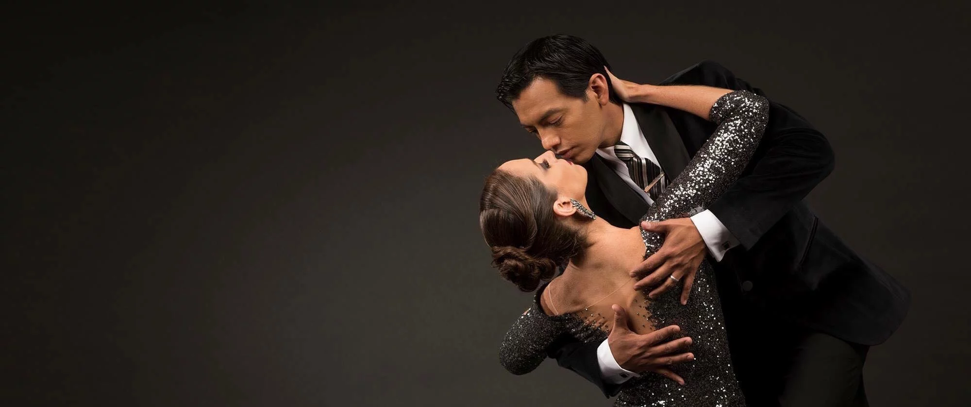 headshot of tango dancers in a dramatic pose