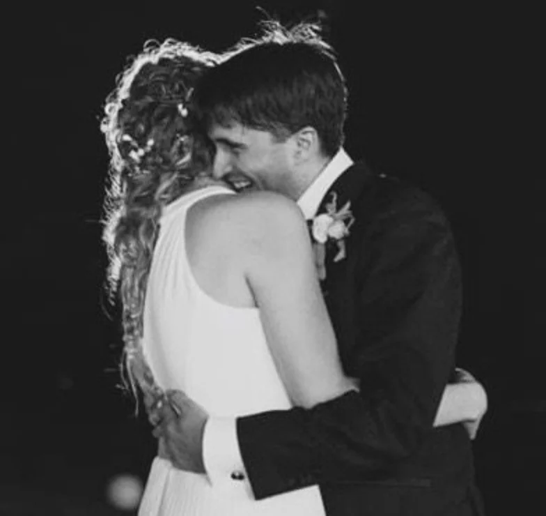bride and groom embracing