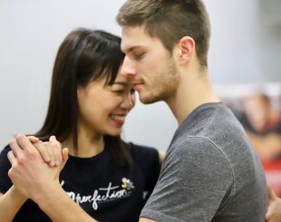 smiling tango students in lesson