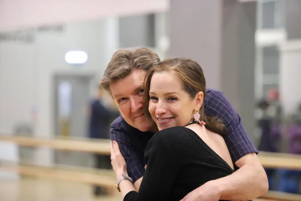 tango teacher hugging student