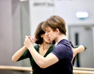 tango students in a close embrace