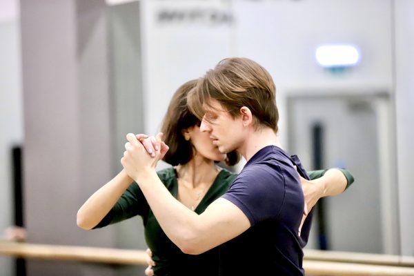 tango students in a close embrace