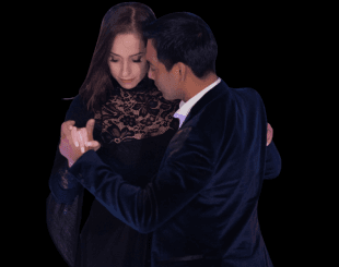 tango teachers navigating a crowded dance floor